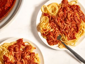 Plates of spaghetti with a tomatobased meat sauce presented for a meal