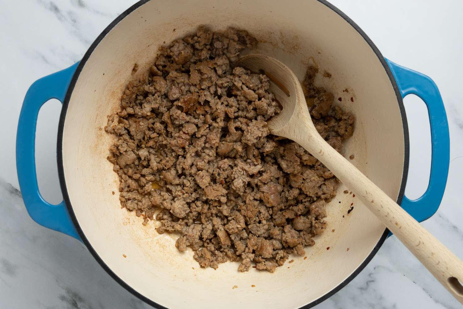 Sausage Cooking in a Dutch Oven for Dirty Rice With Shrimp Recipe