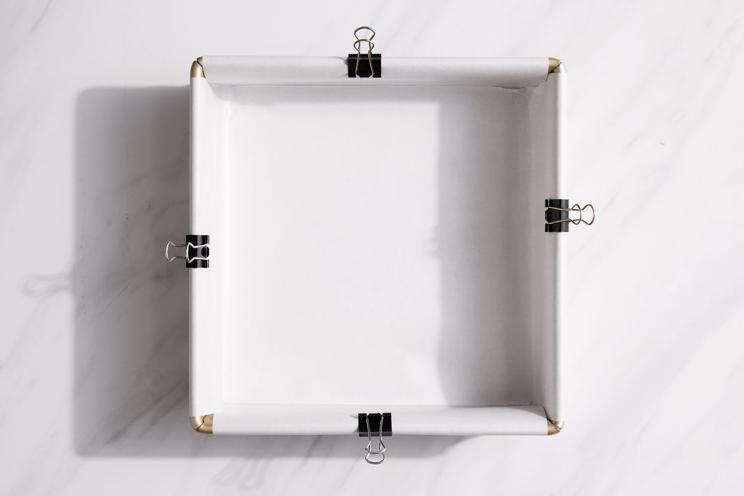 Baking Pan Lined with Parchment Paper for Peppermint Caramels Recipe