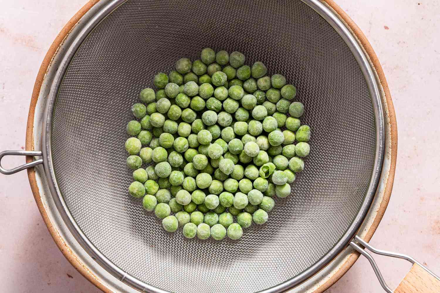 Frozen Peas in a Colander Over a Bowl for Fusilli Recipe