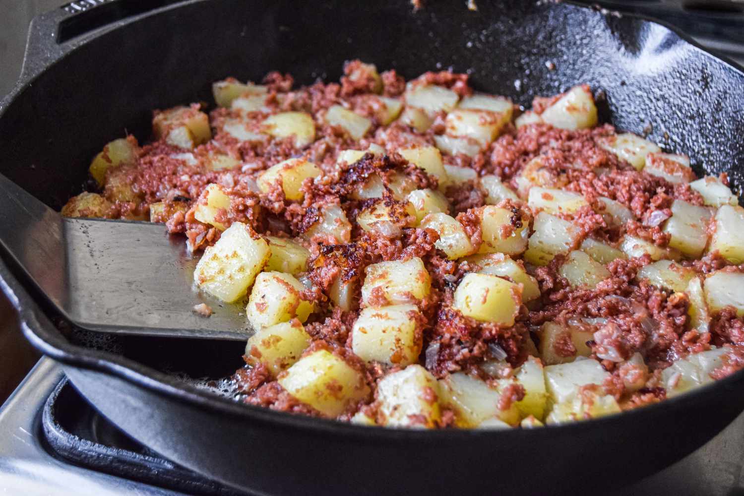 Potatoes and Beef Added to Skillet for Cornbeef Hash