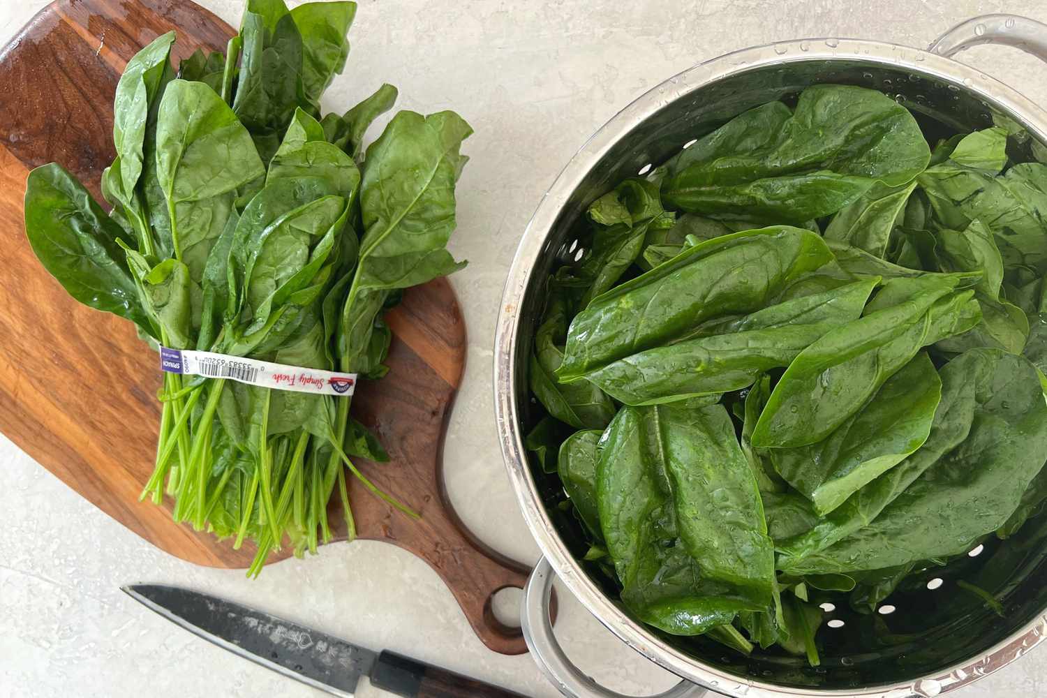 Washed Spinach Drained in Colander for Vegan Creamed Spinach