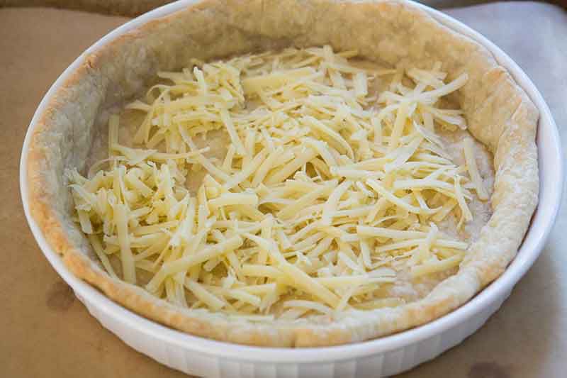 Cheese added to the prebaked crust