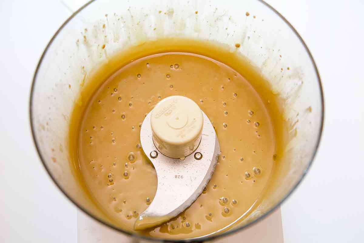 Blending the oil and tahini first helps it blend into the chickpeas better