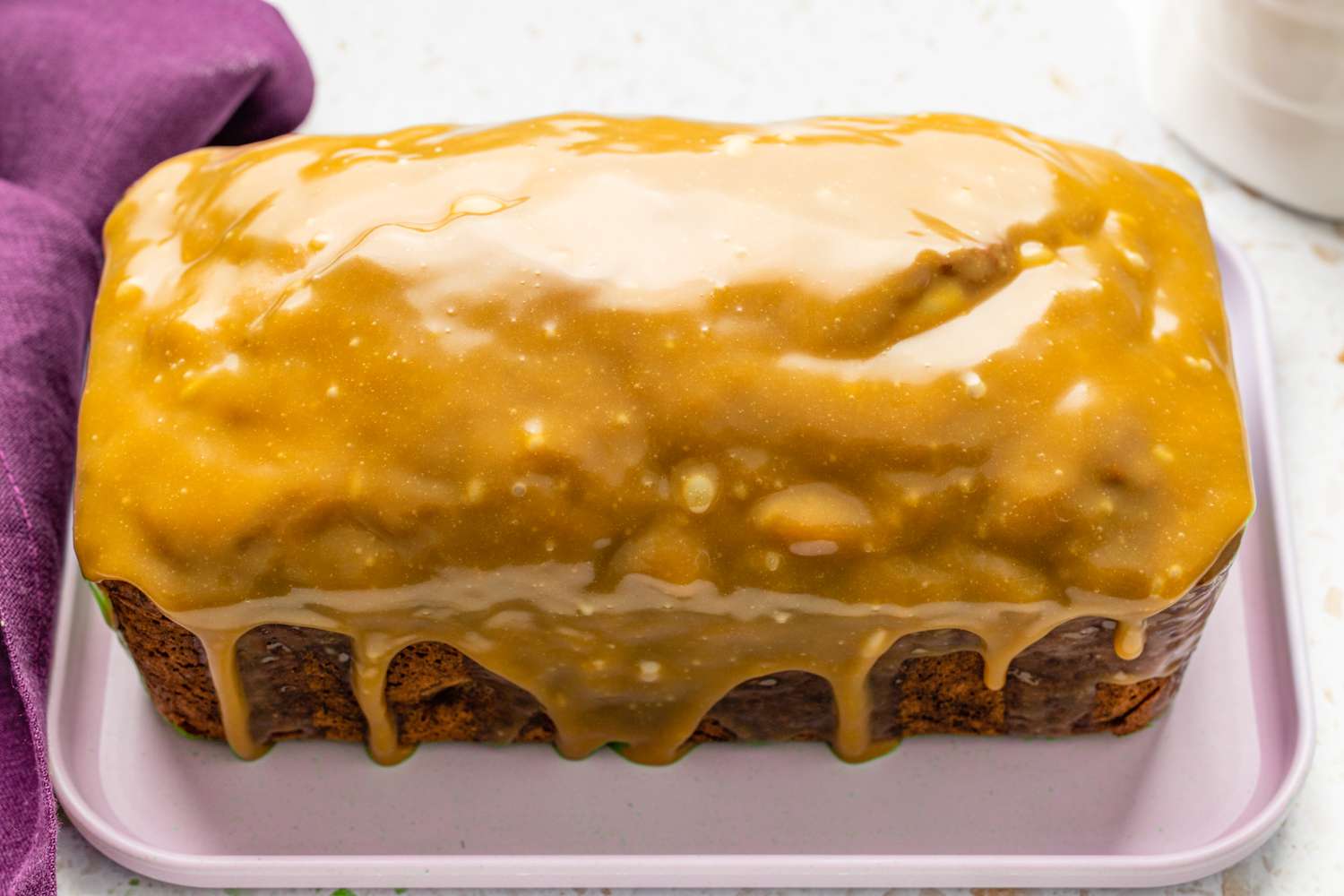 Banana Pecan Bread With Caramelized White Chocolate Sorghum Glaze on a Platter