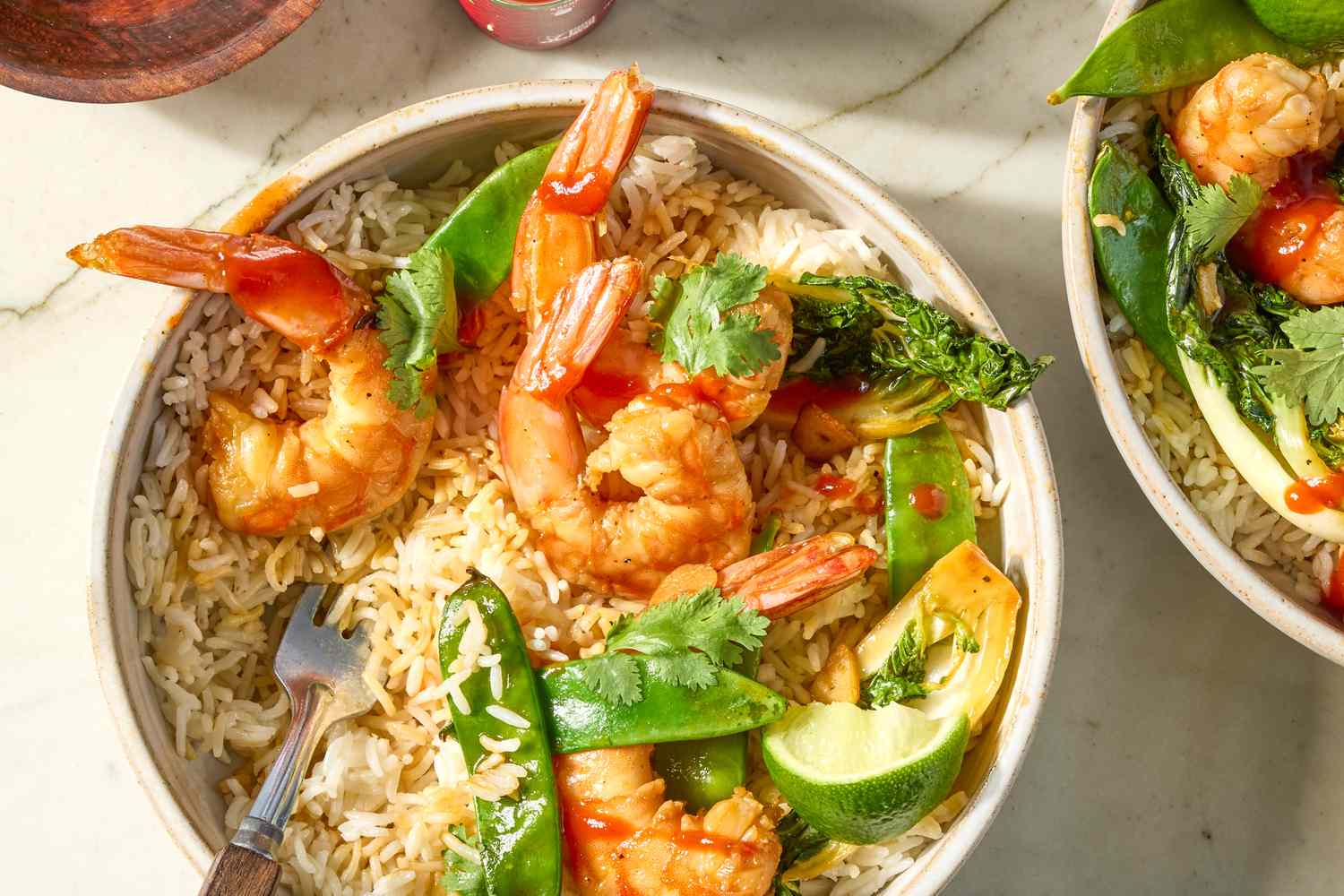 overhead view of Shrimp Stir Fry in a bowl with a fork