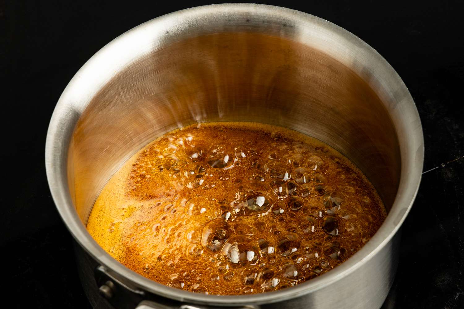 Sorghum Heated in a Pot on the Stove