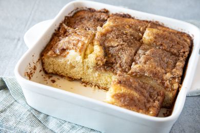 A baking pan with bisquick coffee cake and two squares removed from the pan.