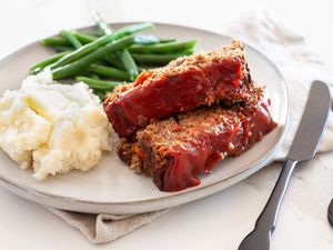 Vegetarian Meatloaf on a Plate with Mashed Potatoes and Green Beans