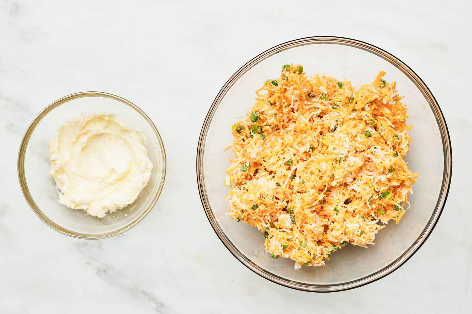 Bowl of Cheese and Green Onion Mix and a Bowl of Garlic Butter for Cheesy Bread Recipe