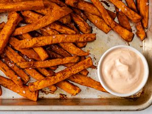 Sweet potato fries on a baking sheet.