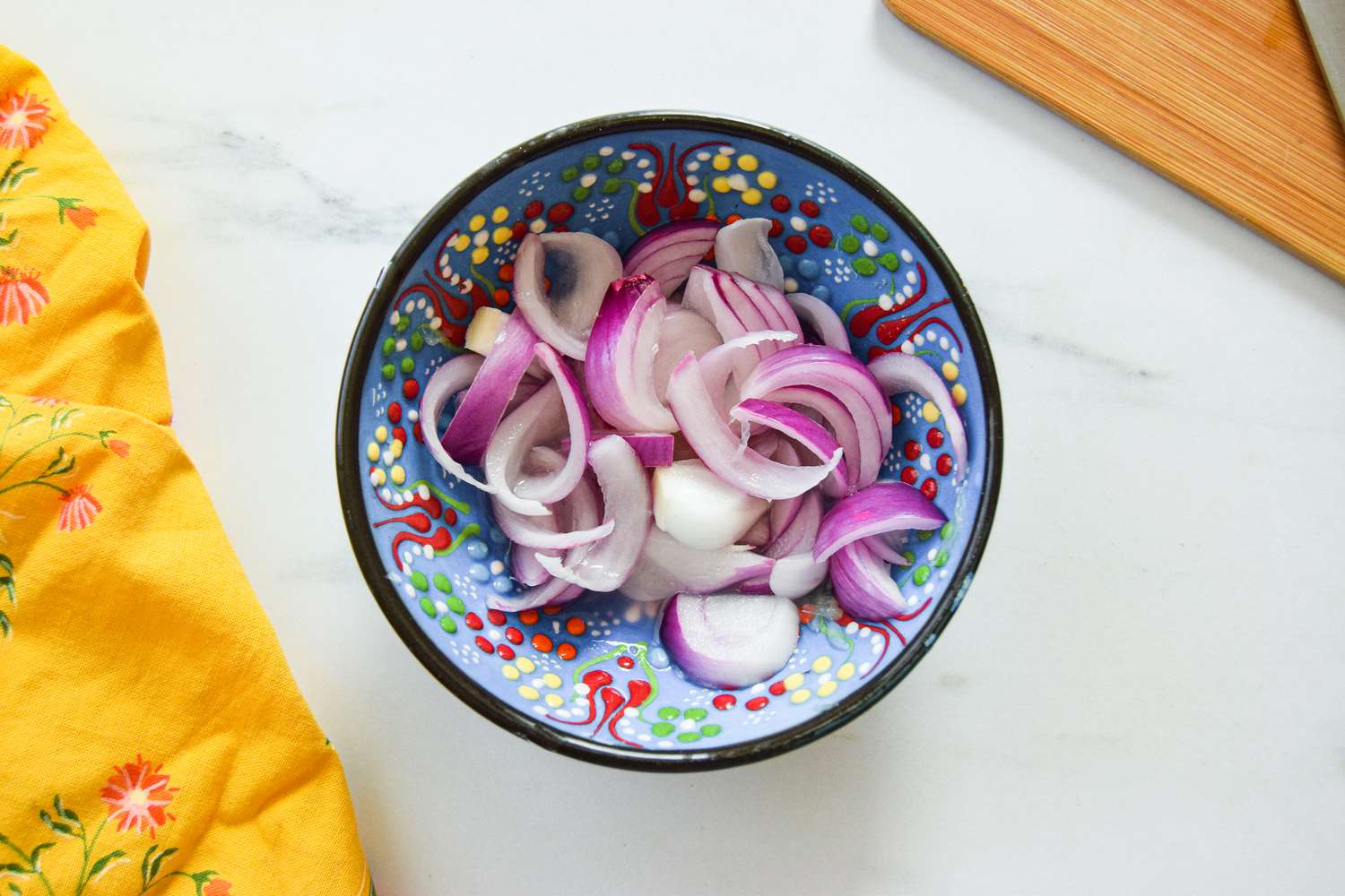 Sliced Red Onions Mixed with Salt and Lemon to Make Pickled Onions for Daal Palak Recipe