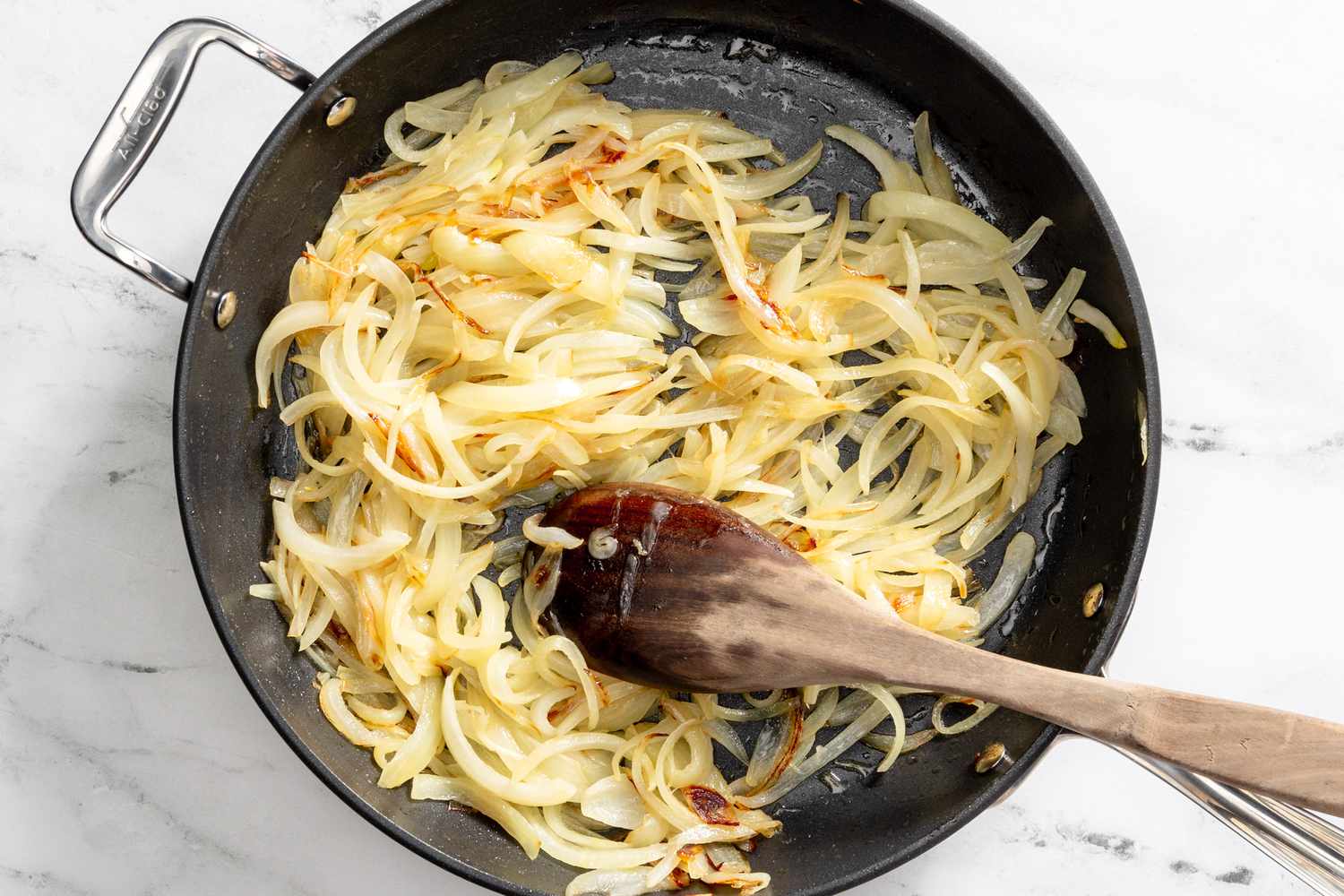 onions sauteed in the pot for French onion pasta recipe