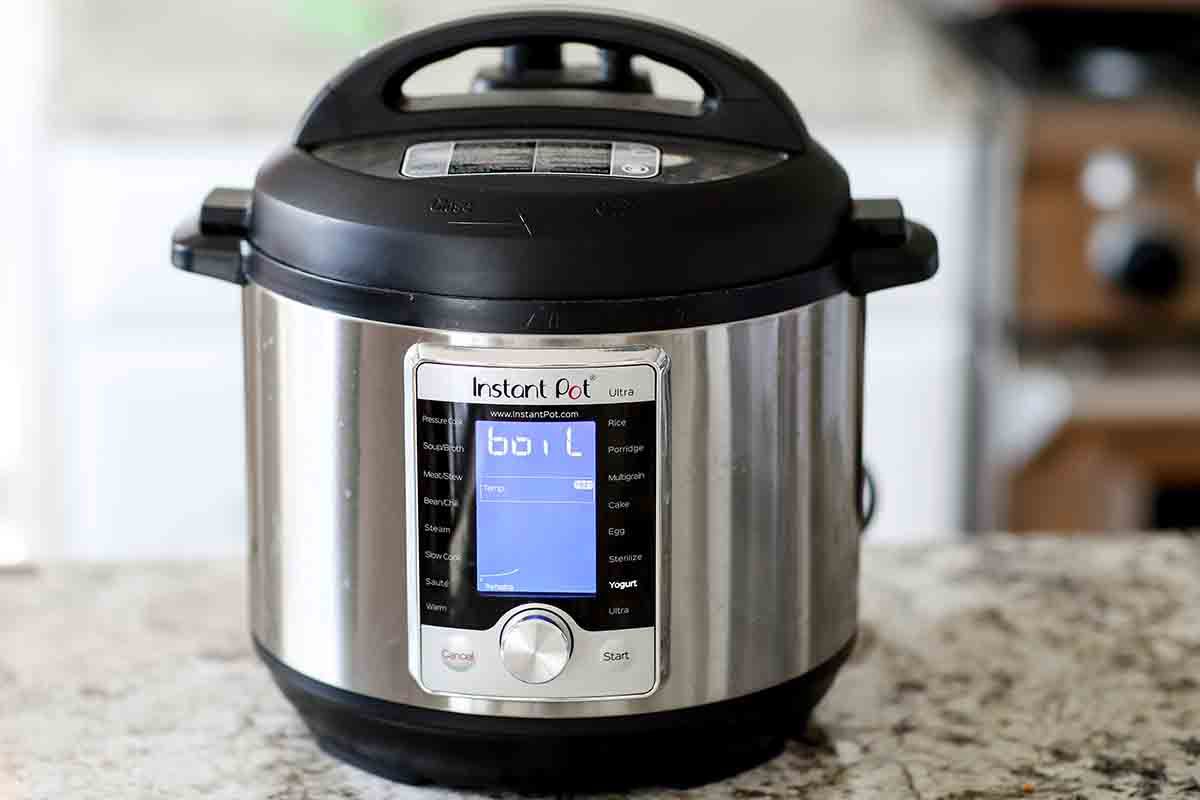 A pressure cooker set to boil