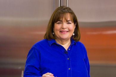 Ina Garten smiling and standing indoors