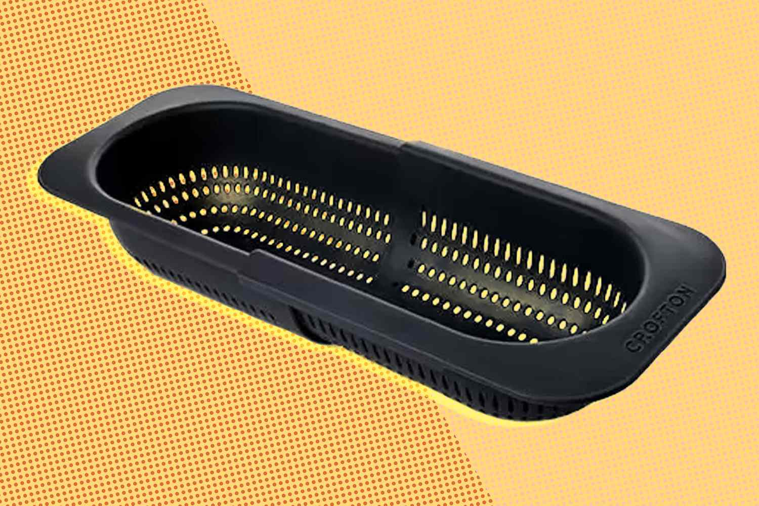 ALDI's Expanding Colander on a yellow illustrated background