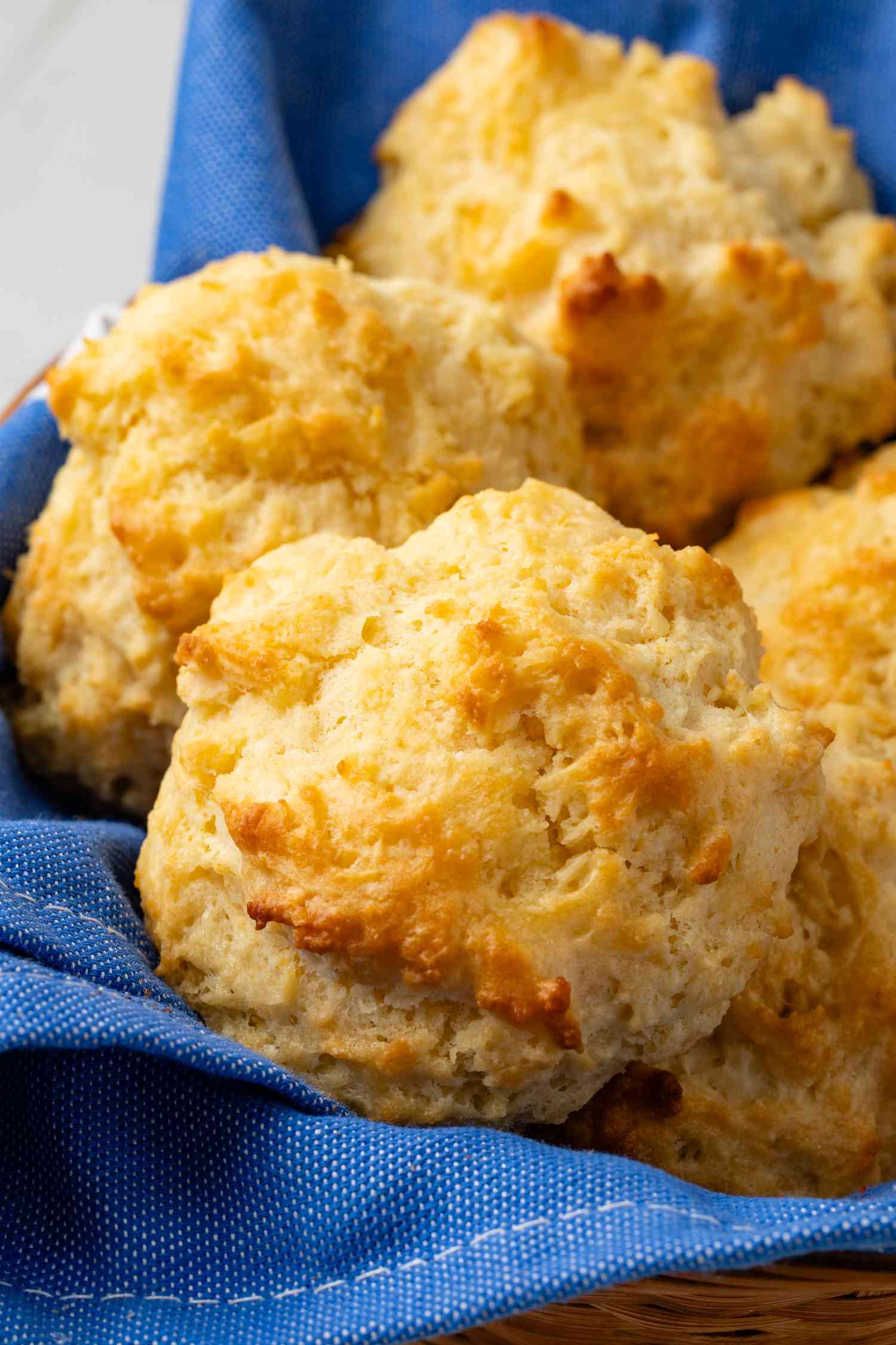 Drop biscuits in a table napkin-lined basket