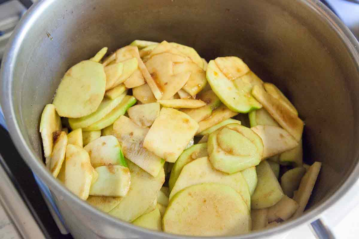 toss apples in cinnamon and sugar for deep dish apple pie