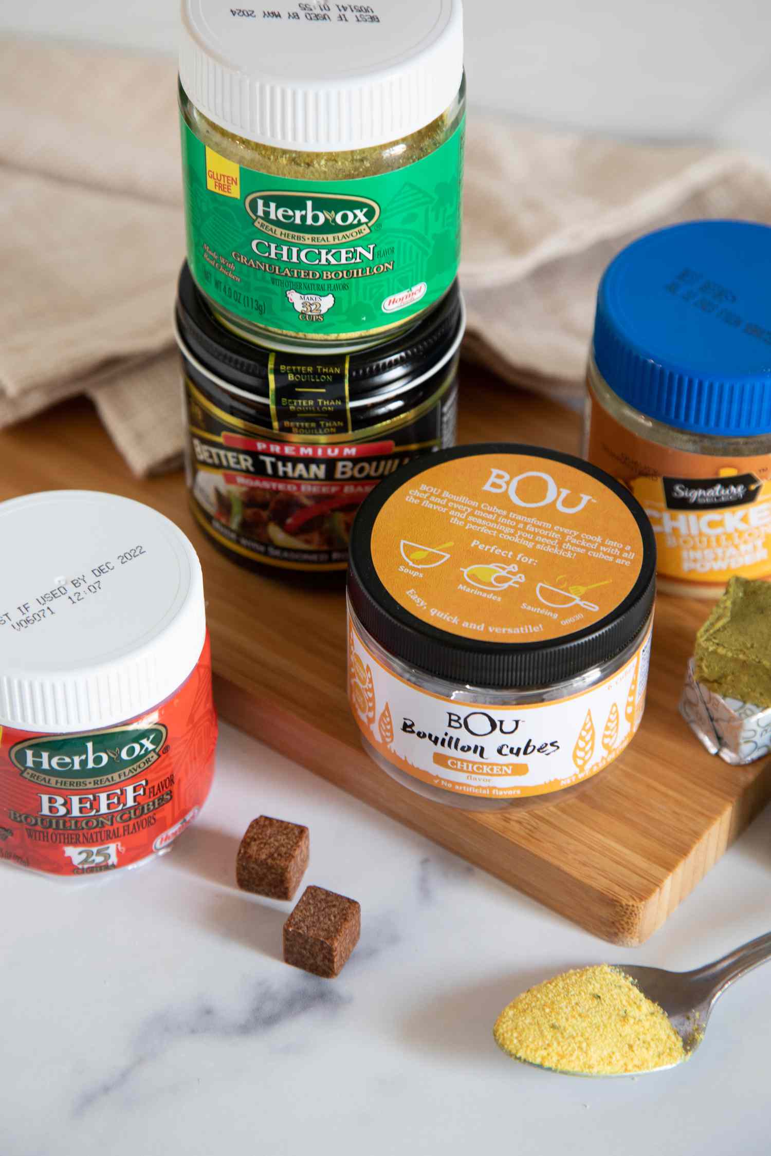 A collection of bouillon cubes, powder, and paste