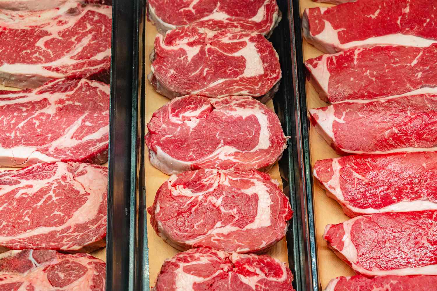 Display of fresh cuts of beef on a butchers counter
