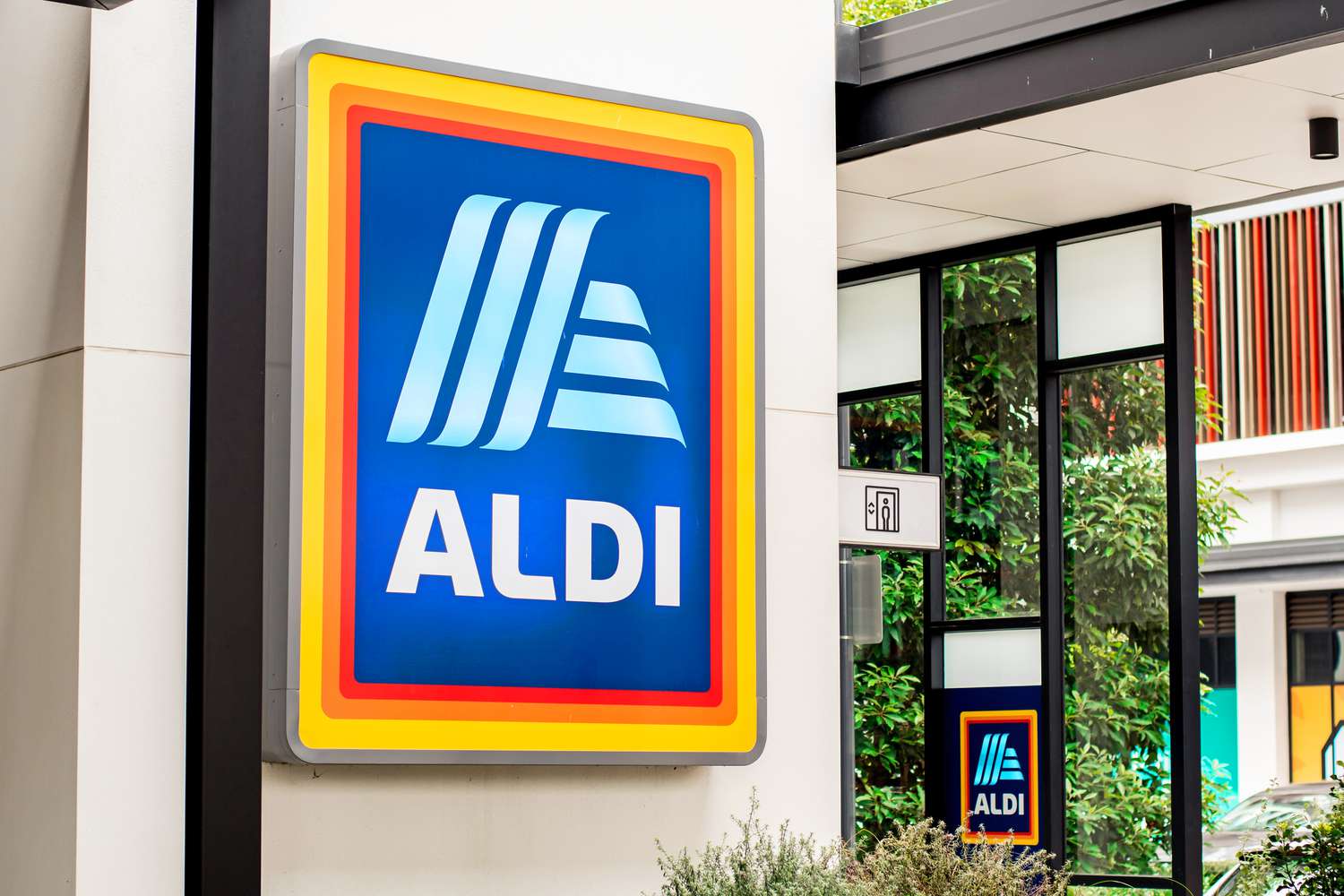 A large ALDI sign on the outside of an ALDI store