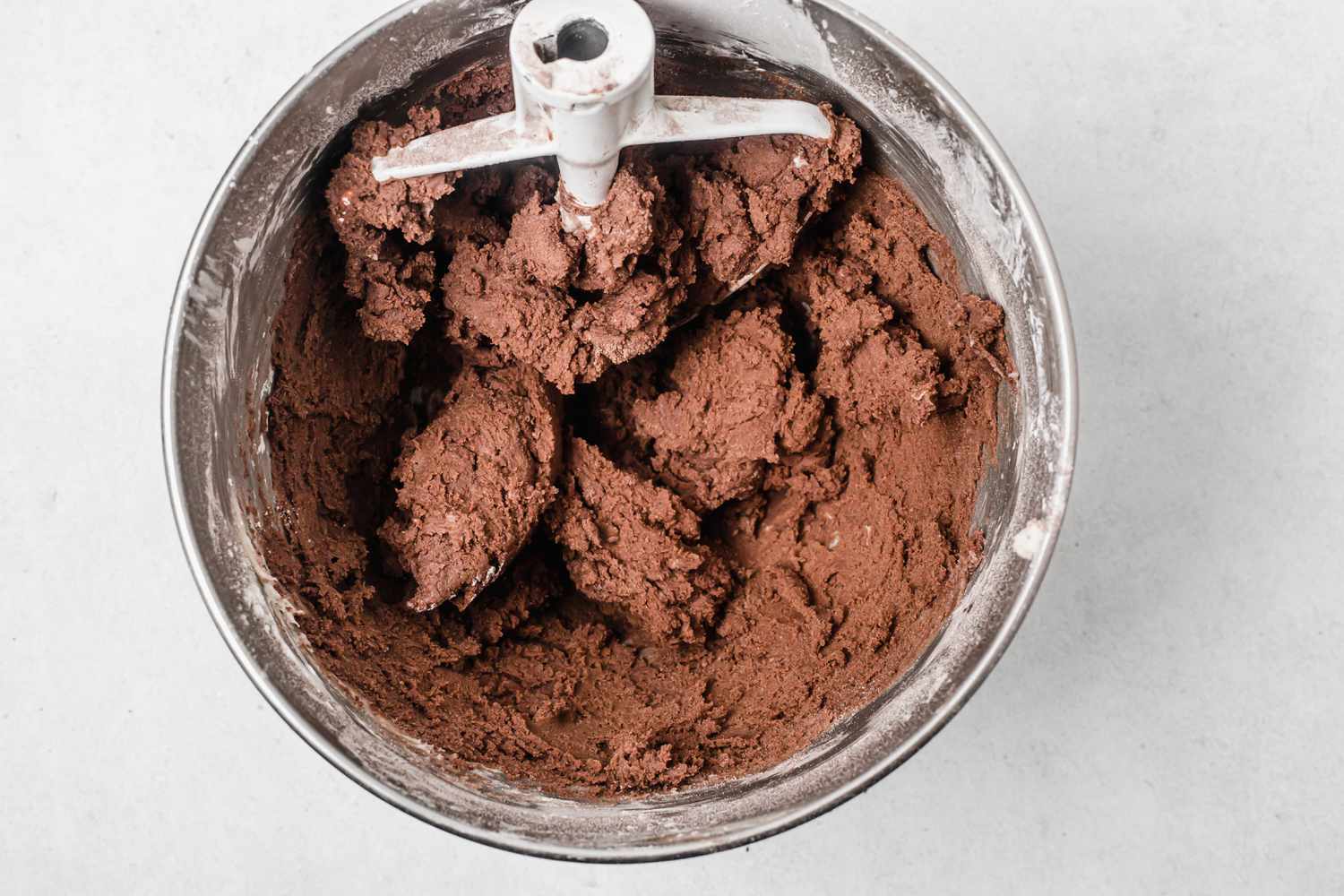 Chocolate dough in a bowl to make shortbread dipped in chocolate and peppermint 