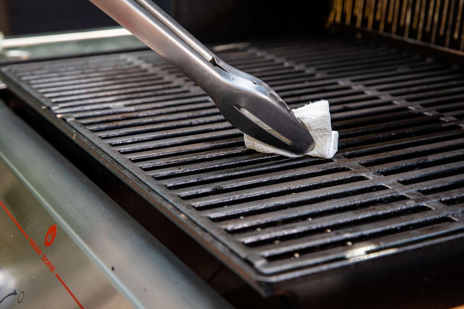 Oil Grill Using a Paper Towel and Tongs