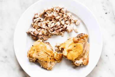 Small bits of cooked chicken removed from bone and without skin