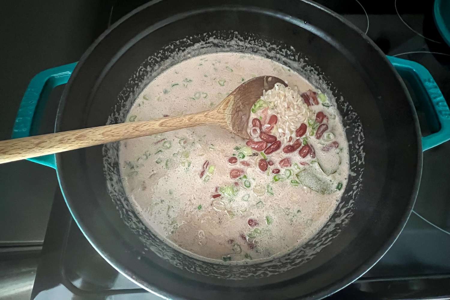 Add Rice to Beans in Dutch Oven for Jamaican Rice and Peas