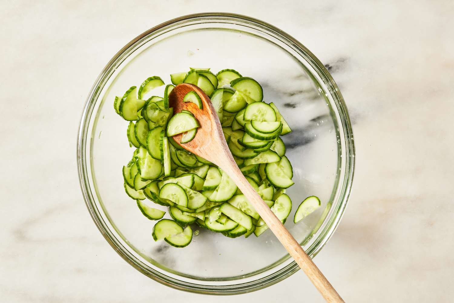 cucumbers salted in a bowl for Korean-style potato salad recipe