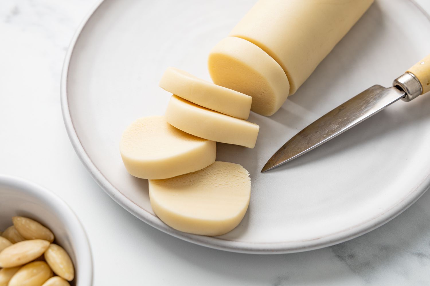 Log of Marzipan with Sliced Marzipan Disks Next to It