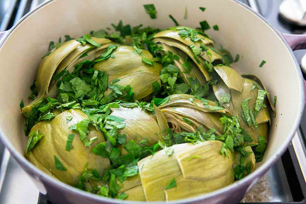 cooked braised artichokes in pot