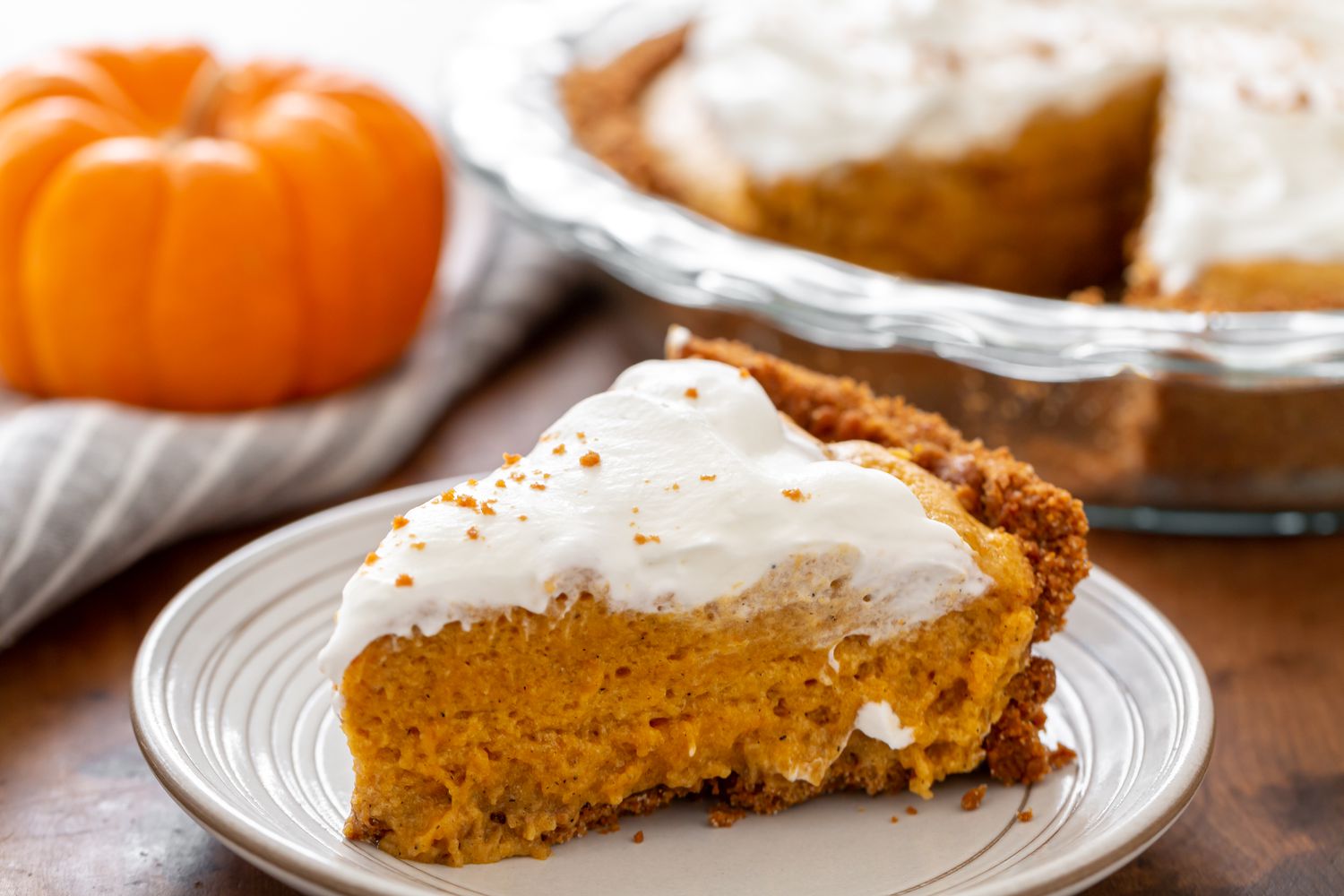 Slice of Pumpkin Chiffon Pie with whipped cream