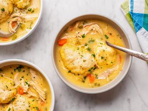 overhead view of Easy Chicken and Dumplings in bowls with spoons
