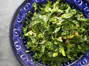 easy kale salad served in a blue bowl
