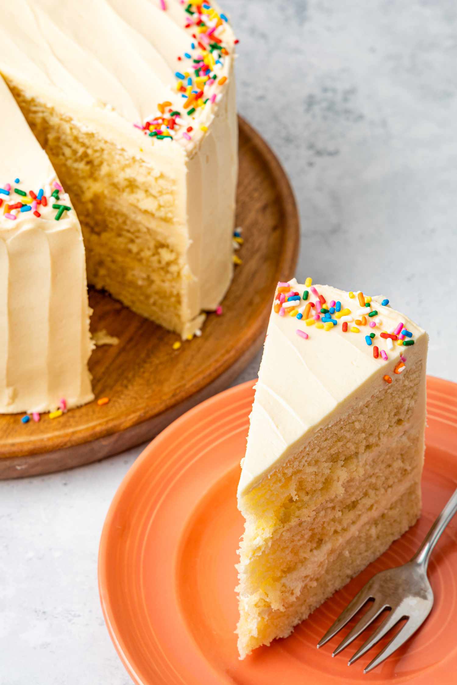 Slice of 3-Layer Microwave Cake with More Cake in the Background