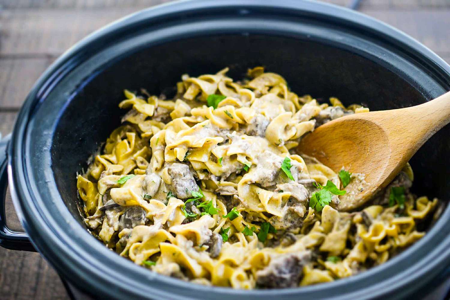 Stir the noodles into the finished crockpot beef stroganoff
