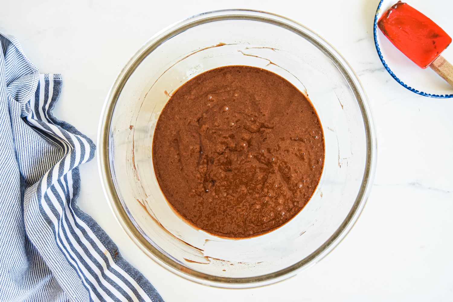 Wet and Dry Ingredients Slowly Mixed Together in a Bowl for Sheet Cake Recipe 