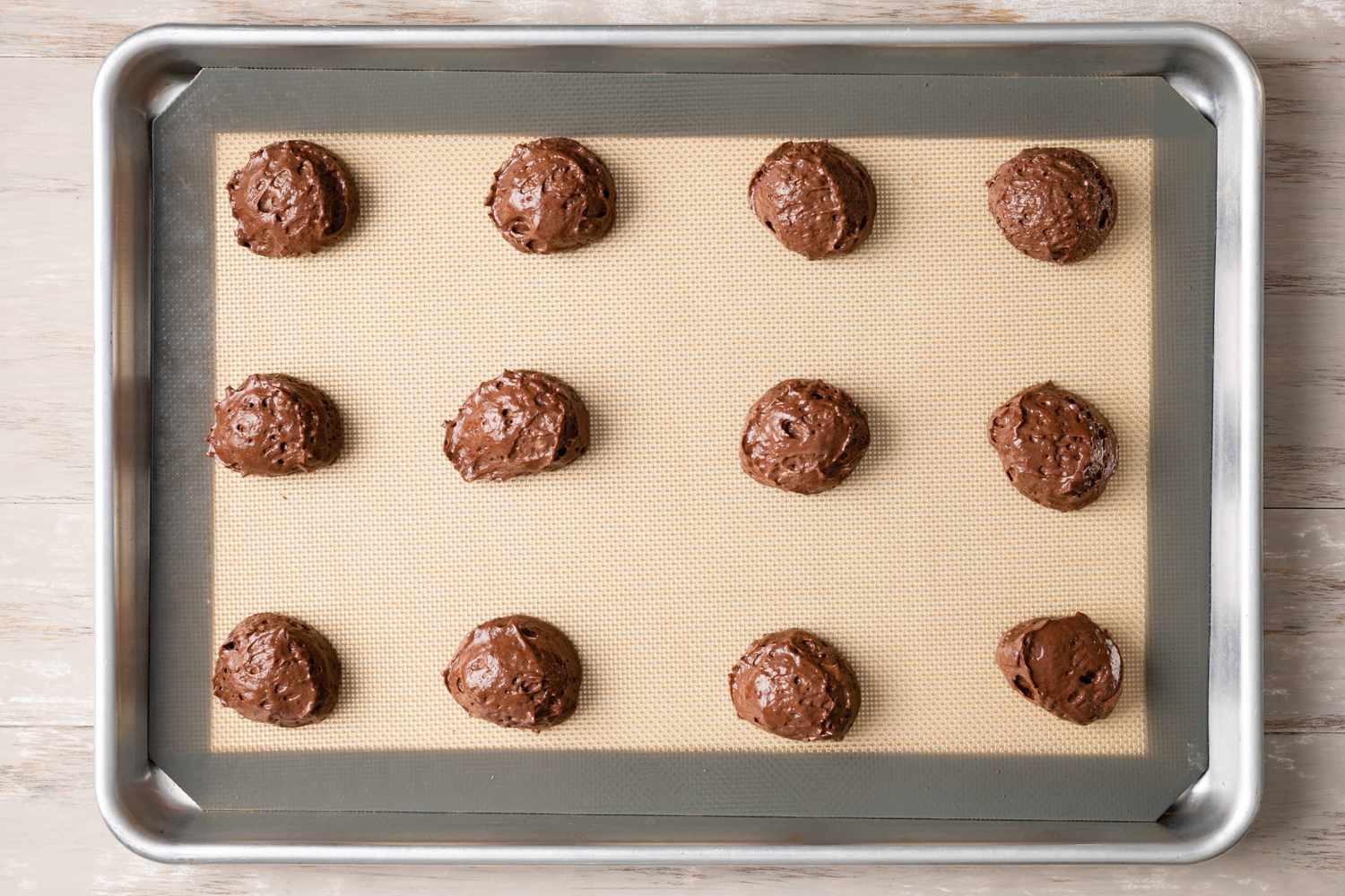 Scooped Batter on a Lined Baking Sheet