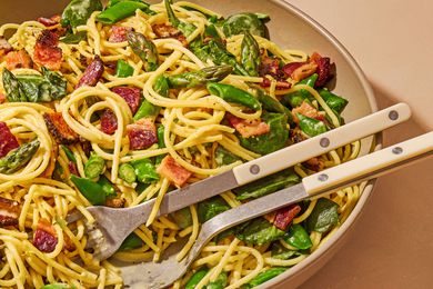 large bowl of Spring Carbonara with serving spoon and fork
