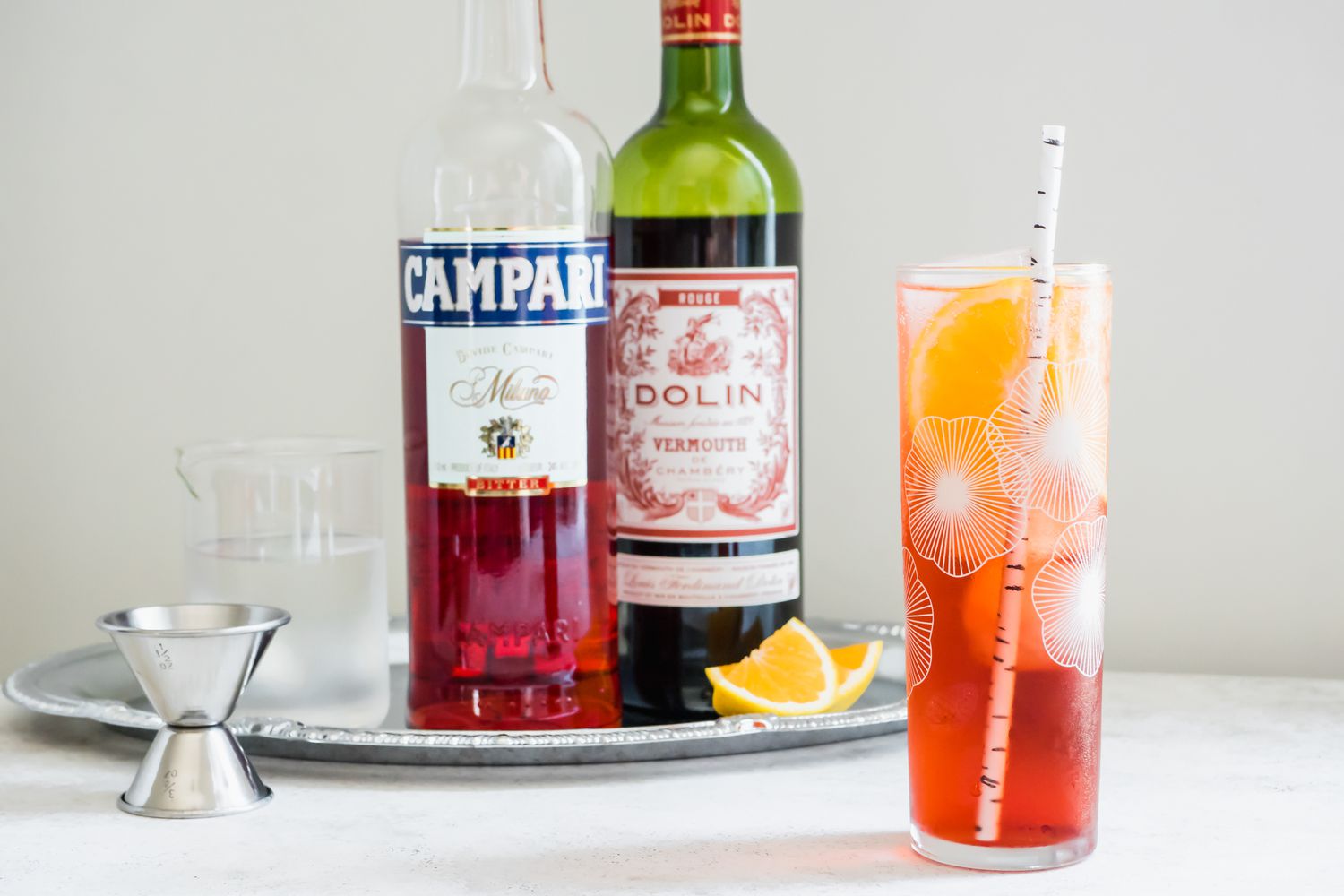 Americano Cocktail with Ingredients in the Background