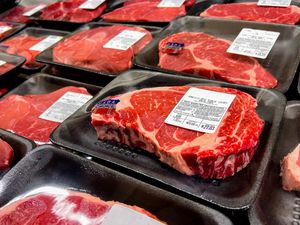 A store shelf with pre-packed steaks