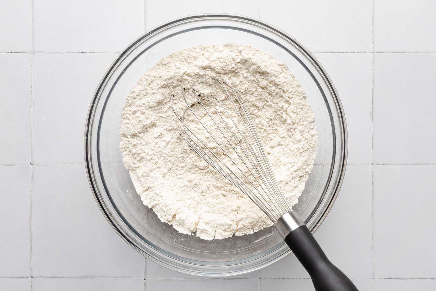 dry ingredients whisked together in a bowl for butter swim biscuits recipe