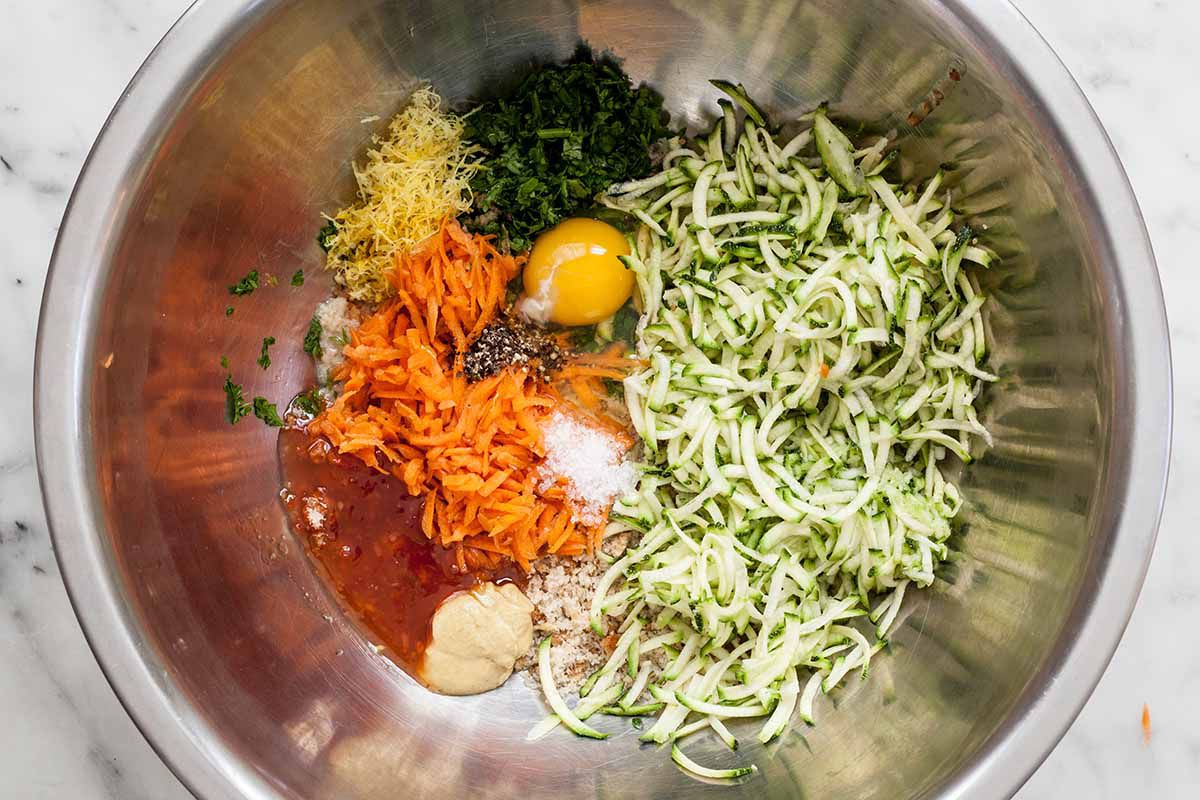 Ingredients for Turkey Meatloaf: sandwich bread, egg, salt and pepper, grated zucchini, grated carrot, grated onion, parsley, lemon zest and juice, mustard