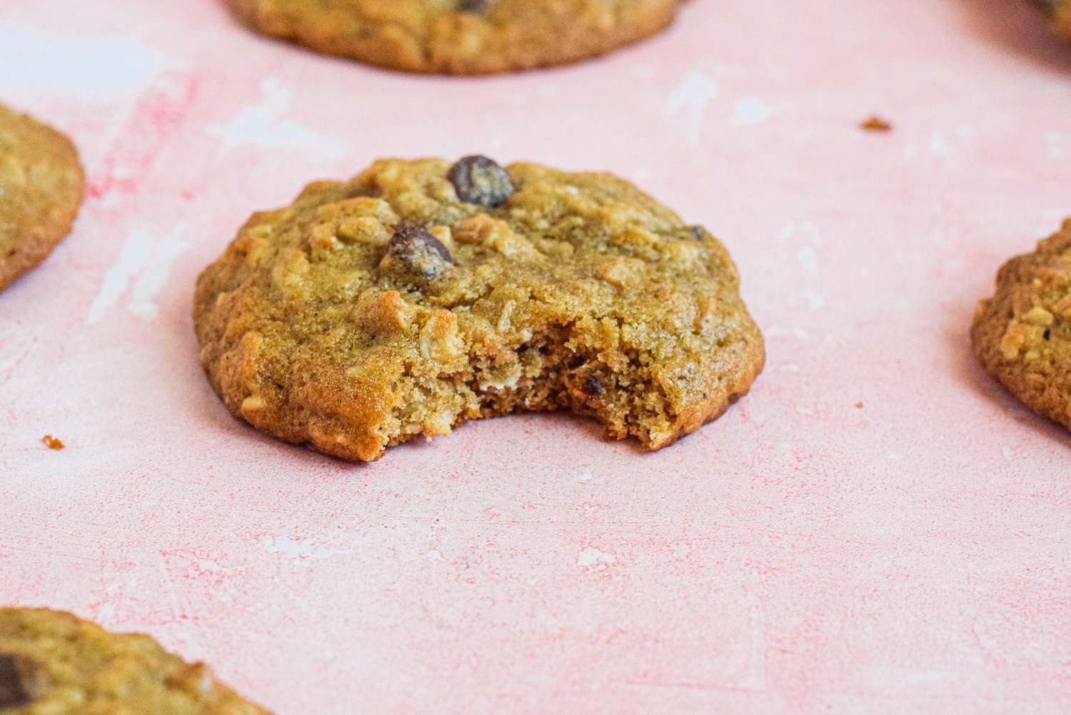 Oatmeal Banana Cookies on the Counter with One Bitten into