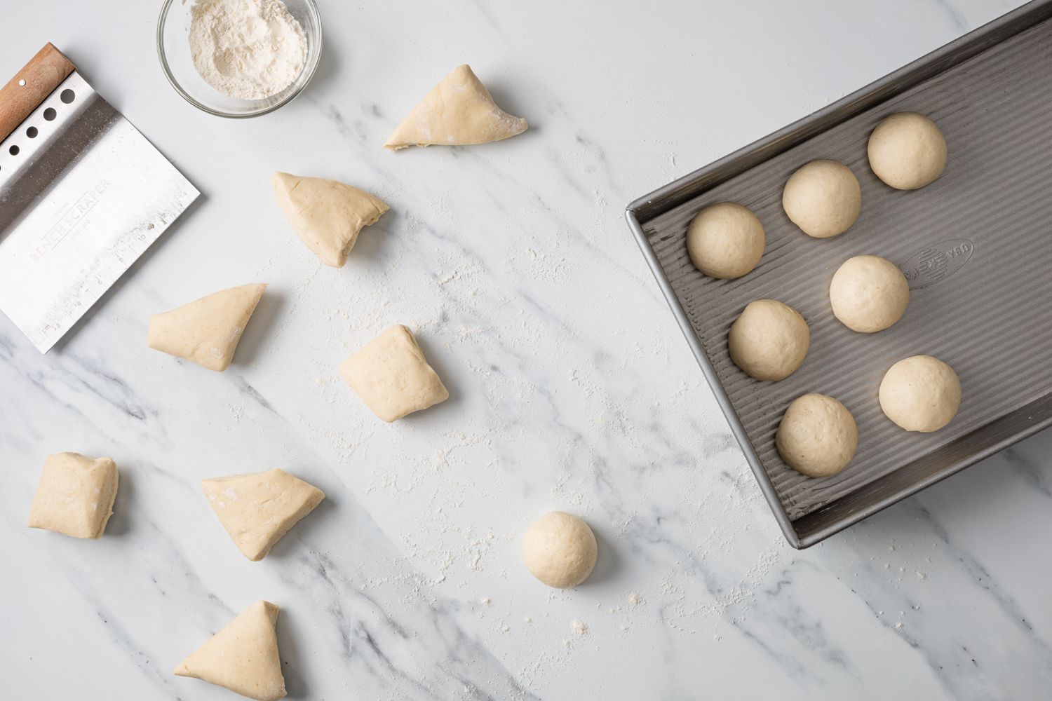 Dough Cut into Pieces, Rolled into a Ball, and Placed in a Baking Pan