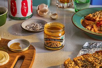 Kitchen counter with makings of soup, including an open jar of Better Than Bouillon