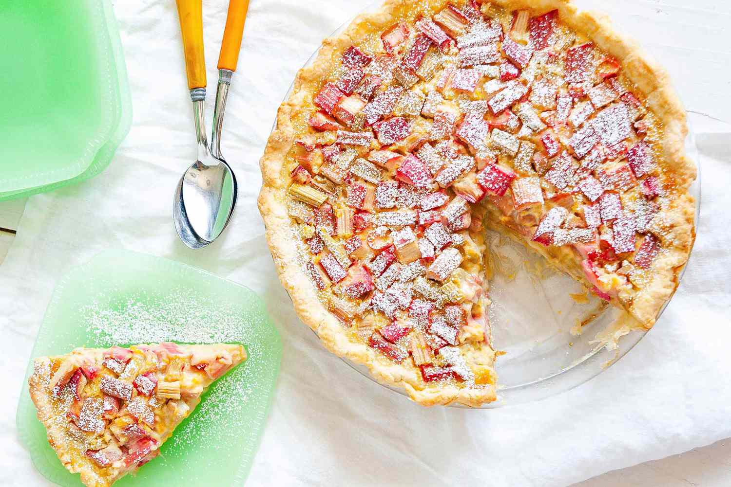 Rhubarb custard pie with a slice taken out