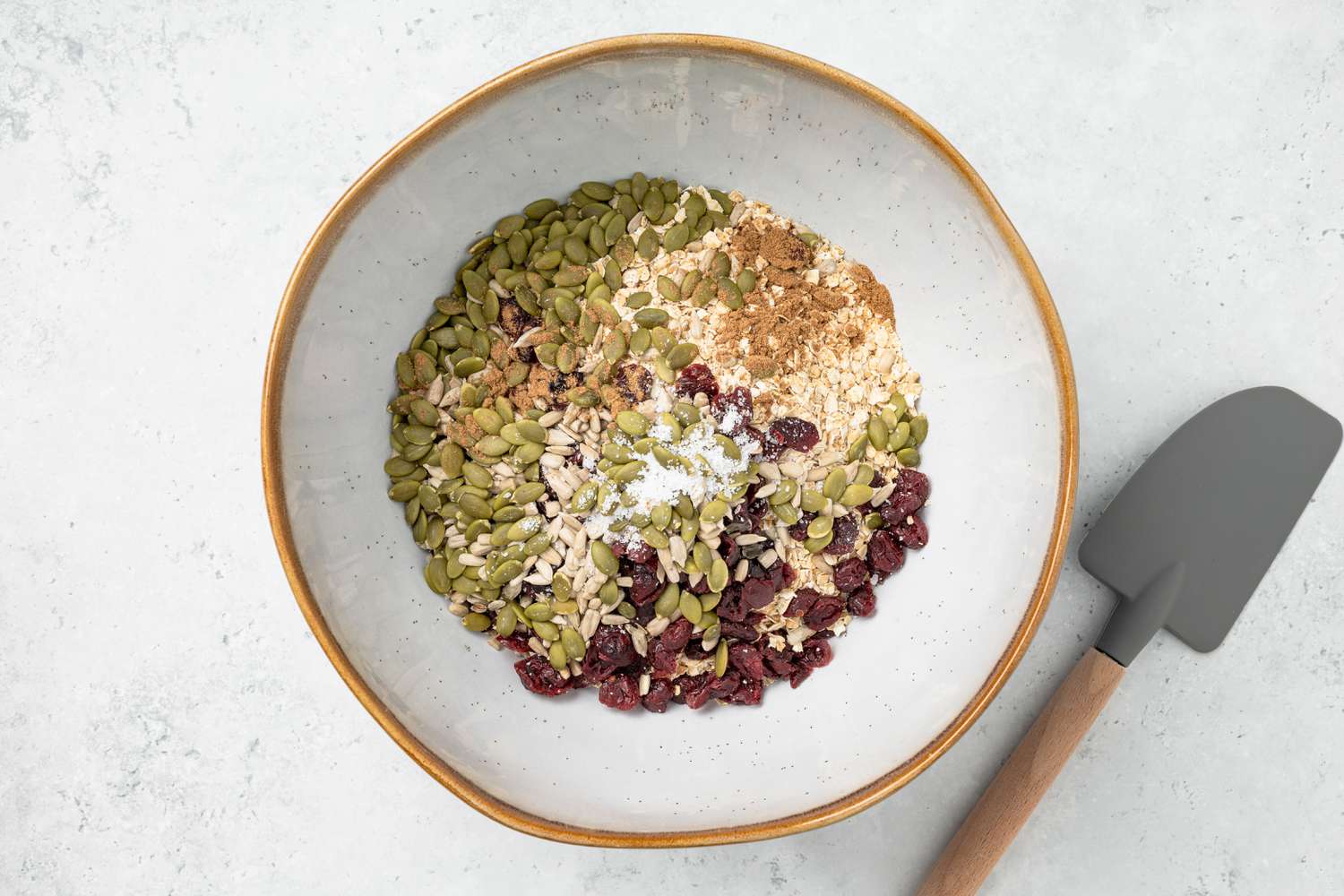 Dry Ingredients in a Bowl With a Rubber Spatula on the Counter