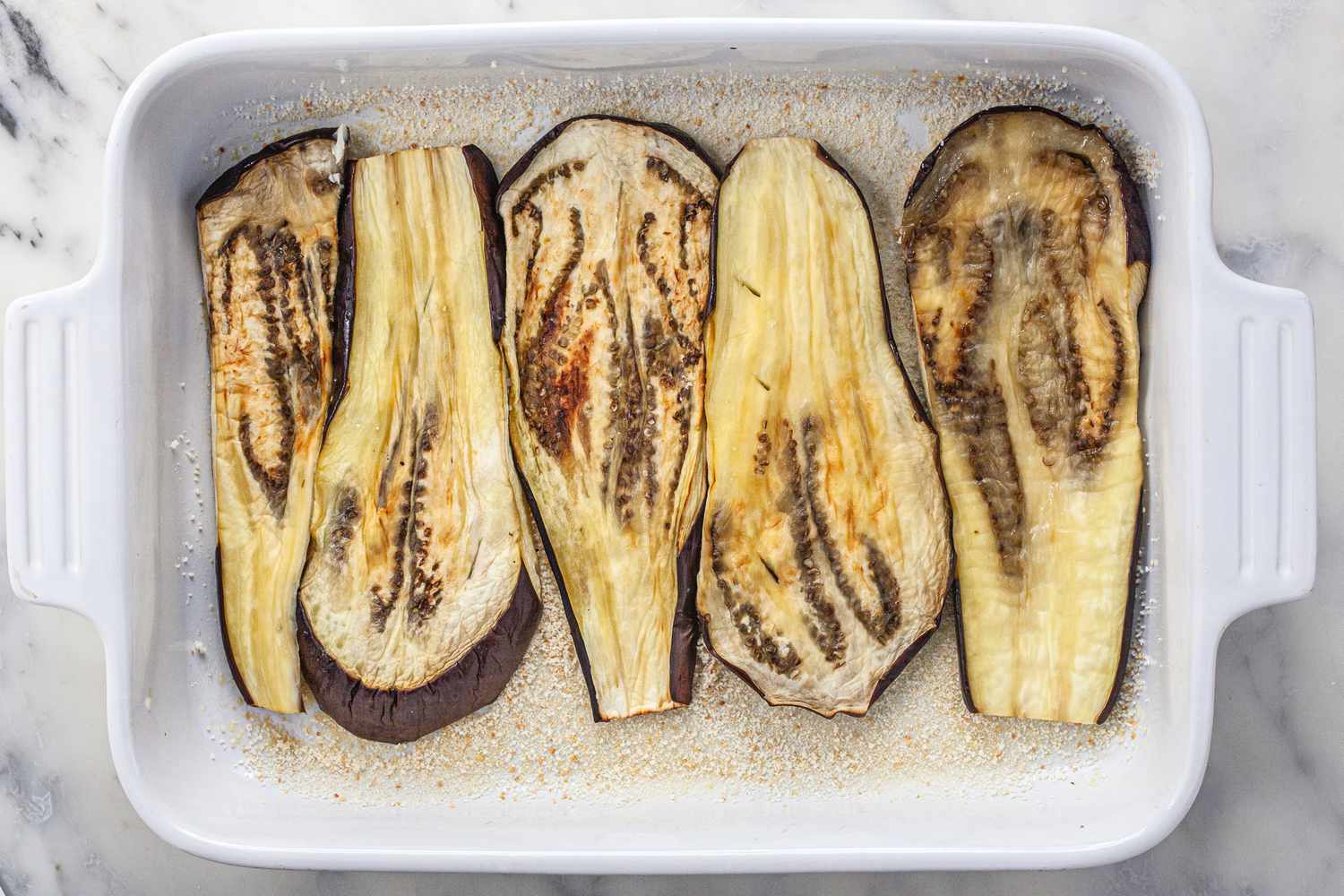 Assemble vegetarian moussaka in casserole